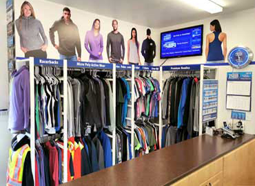 Check out our clothing display! Custom Clothing Services, Tee Shirts, T shirts, T-Shirts, Heat Press T Shirts, Heat Press T-Shirts, Clothing, Hoodies, Jackets, Sweaters, Embroidery, Silk Screen, Hats, Toques, Fitted Hats, Embroidered Ball Caps, Team Uniforms, Sew-On Patches, Hooded Tees, Fleece, Dri-Fit, Moisture Wicking, Microfleece, Active Wear, Racerback Racer Back Tanks Tank Tops